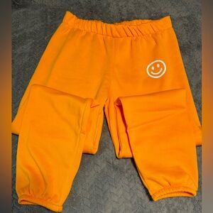 Orange New Sweatpants w/ Smile Face. Sz L